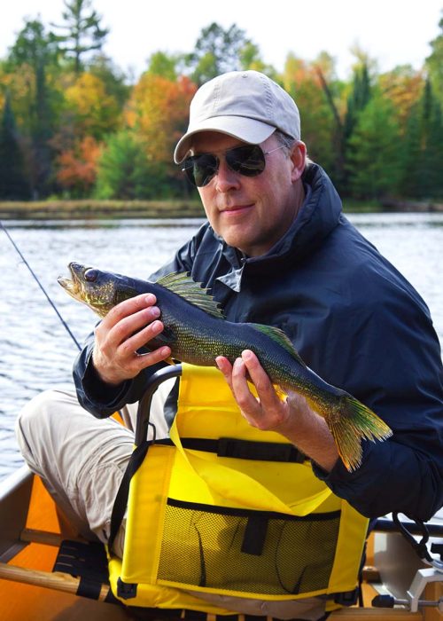 happy-fisherman-holds-up-a-walleye-on-a-northern-m-DN2SM64-resize.jpg happy-fisherman-holds-up-a-walleye-on-a-northern-m-DN2SM64-resize.jpg